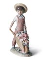 Figura niño Carretilla con flores