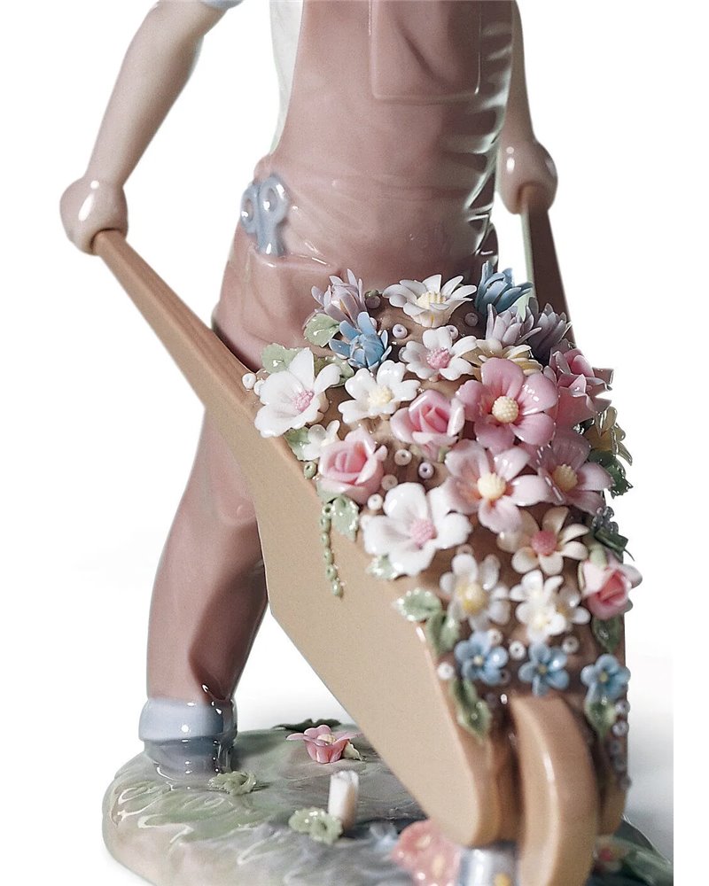 Figura niño Carretilla con flores